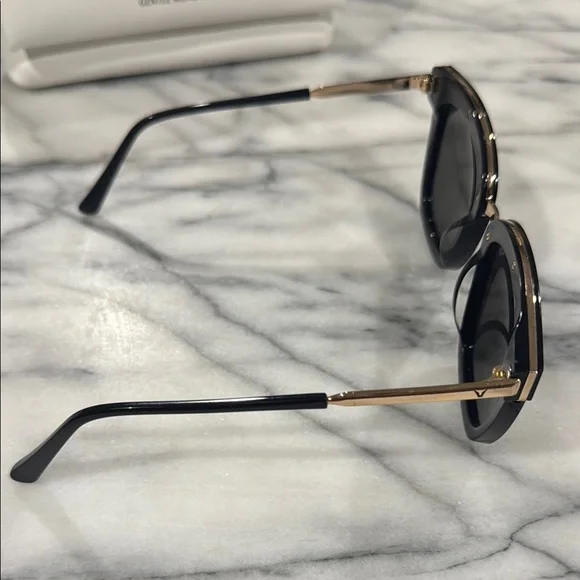 Gentle Monster Black Sunglasses with Gold Accent